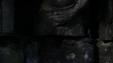 Ancient Temple (Angkor) - Tilt Up to Mystery Carving Stock Footage