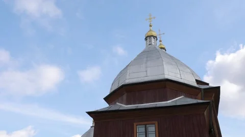 The ancient temple, the dome on the background of the sky. Wooden church Stock Footage 231596154
