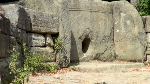 Ancient temple or funeral structure. Stone dolmen resembling small house. Stock Footage 134062556