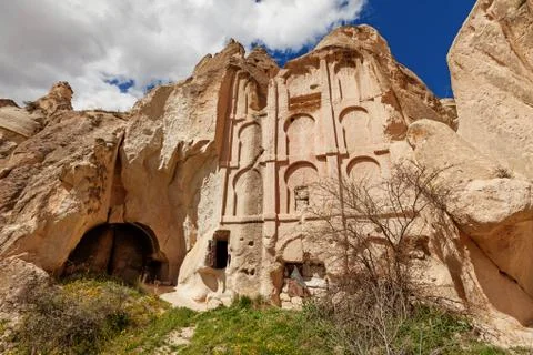 Ancient temple in stone cliffs Stock Photos
