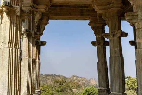 Ancient temple stone pillars unique architecture with bright blue sky at mo.. 库存照片