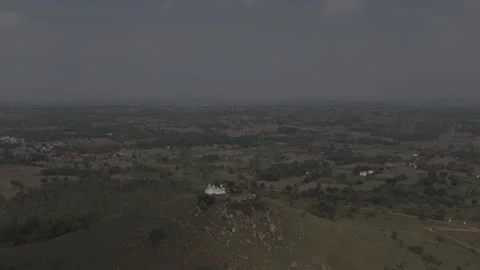 Ancient temple surrounded by dense forest and mountain Dlog Footage Stock Footage 302265330