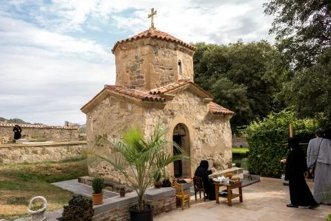 The Ancient Tiny Stone Church Of St. Nina At The Area Of Samtavro Monastery Comp Фото