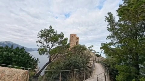 Ancient Torre del Verger Watchtower on Coastal Cliff in Mallorca, Spain 動画素材 332736761