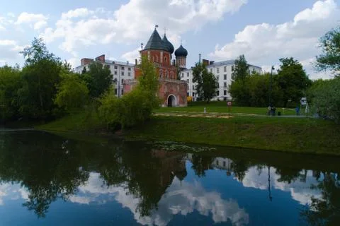 An ancient tower with reflection in a pond. Stock Photos