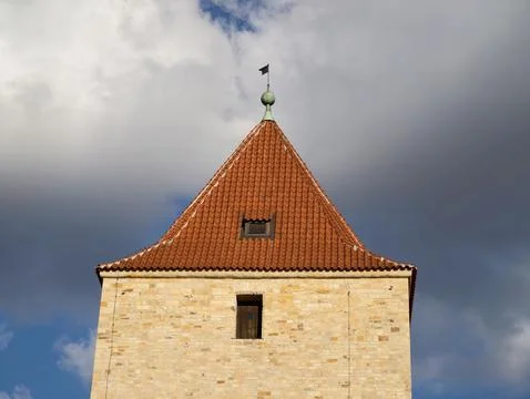 Ancient Tower Scene. Old Stone Edifice Featuring Weather Vane And Textured .. Fotos de archivo