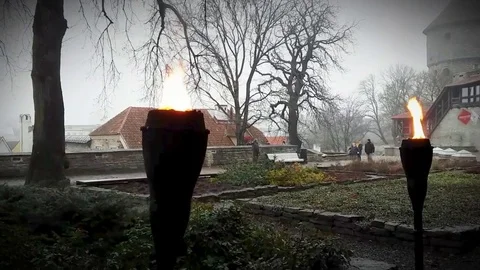 Ancient tower wall highlighted by pair of iron torch. Stock Footage 70500797