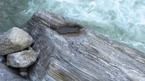 Ancient Tree Root on Rocky Cliff Above Misty Lake Stock Footage 336594936