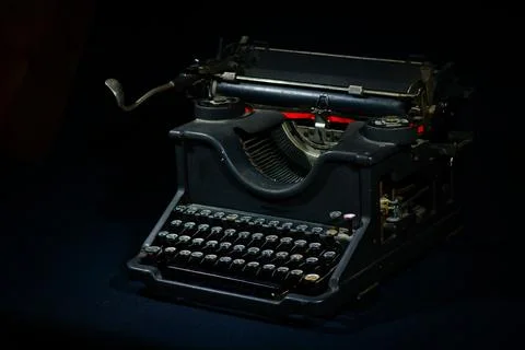 Ancient typewriter on a black background Stock-Fotos