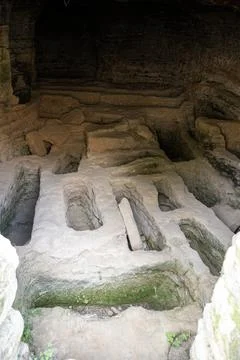 Ancient underground structure with carved stone in the Roman Necropolis of .. Stock Photos