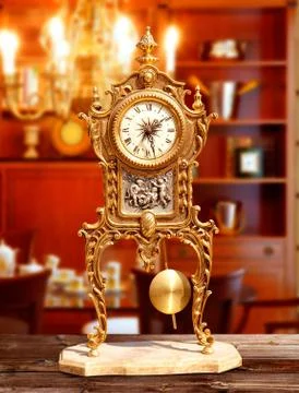 Ancient vintage brass pendulum clock Stock Photos