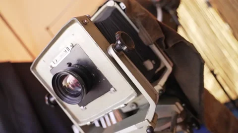 Ancient vintage old retro camera on tripode with lens Stock Footage 239445029