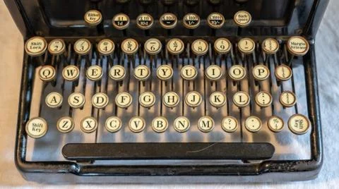 Ancient vintage portable typewriter with qwerty keyboard Stock Photos