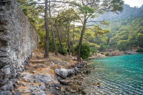 Ancient wall in Cleopatra Bath Bay near Fethie in Turkey Stock Photos