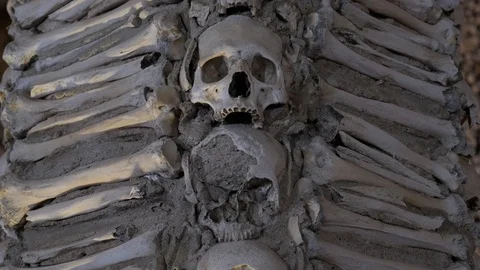 Ancient Wall of Human Bones And Skulls, Tilt Up Stock Footage 93196426
