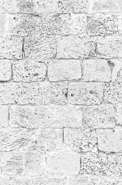 Ancient Wall. Old Distressed Texture of Brickwall. Vertical Grayscale Photo for Stock Photos