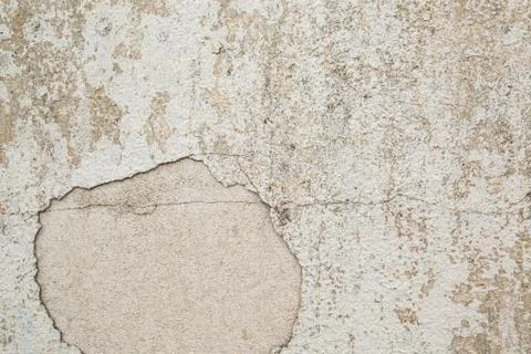 Ancient wall with peeling plaster. Old concrete wall Stock Photos
