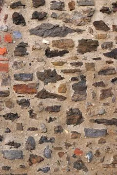 Ancient wall with stones and bricks Stock Photos