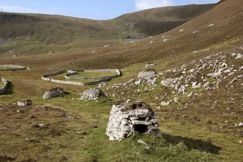 Ancient wall structures and shelters, i.e. cleits, on the remote archipelago  Stock Photos