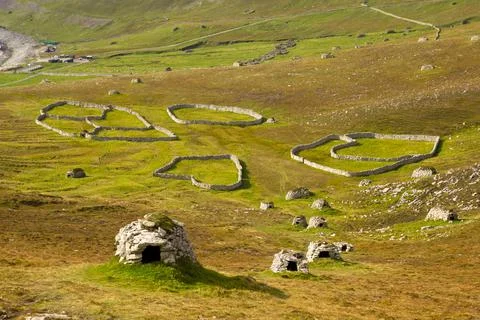 Ancient wall structures and shelters, i.e. cleits, on the remote archipelago  Stock Photos