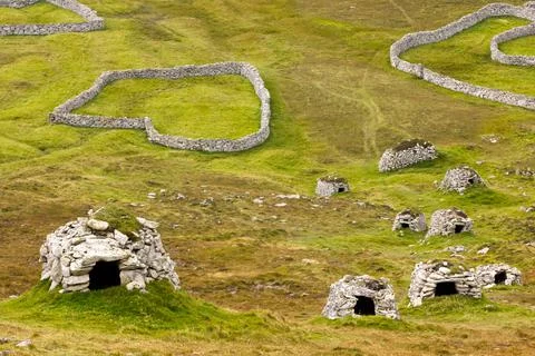 Ancient wall structures and shelters, i.e. cleits, on the remote archipelago  Stock Photos
