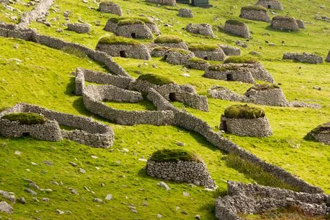 Ancient wall structures and shelters, i.e. cleits, on the remote archipelago  Stock Photos