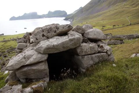Ancient wall structures and shelters, i.e. cleits, on the remote archipelago  Stock Photos