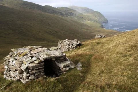 Ancient wall structures and shelters, i.e. cleits, on the remote archipelago  Stock Photos