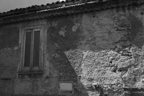 An ancient wall with a window Stock Photos
