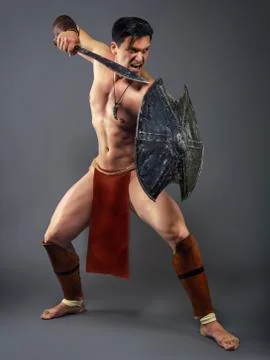 Ancient warrior in a combat stance Stock Photos