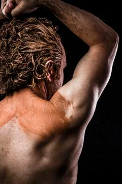 Ancient warrior covered in mud, back Stock Photos