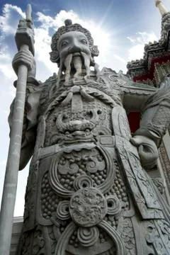Ancient warrior statue is stand alone at temple in Bangkok, Wat Pho in Thailand. Stock Photos