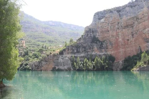 Ancient Watchtower and Limestone Cliffs at Cortes de Pallas Reservoir 스톡 사진