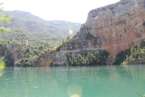 Ancient Watchtower and Limestone Cliffs at Cortes de Pallas Reservoir 스톡 사진