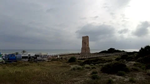 Ancient watchtower called Torre Ladrones in the dunes of Artola, Marbella. Stock Footage 287988844