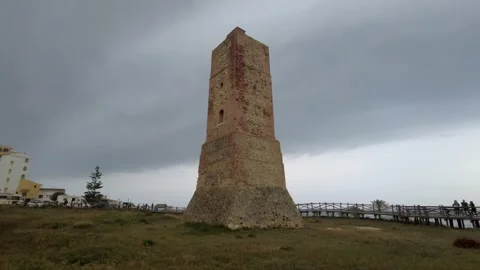 Ancient watchtower called Torre Ladrones in the dunes of Artola, Marbella. Stock Footage 287988950