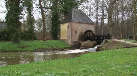 Ancient water mill with an undershot water wheel Stock Footage 62732304