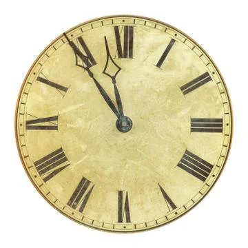Ancient weathered clock face with the time five to twelve Fotos de archivo