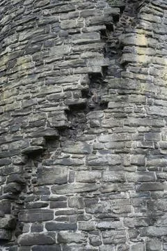 Ancient Weathered Stone Wall Texture With Moss And Lichen, Conwy, North Wales. Stock Photos