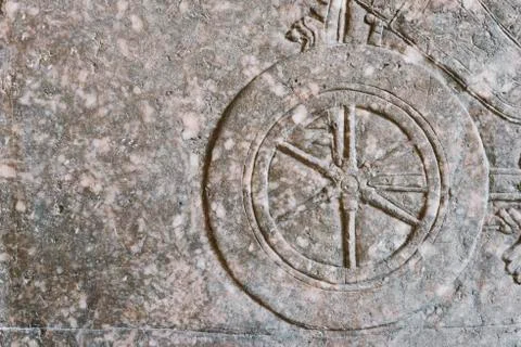 Ancient wheel relief Stock Photos