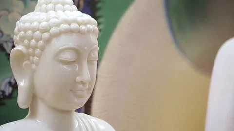 Ancient white buddhist statue - Buddha - pan and tilt Stock Footage 80001603