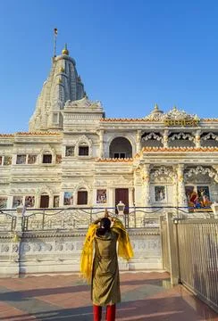 Ancient white marble architecture with devotee offering salutation at dusk .. 스톡 사진