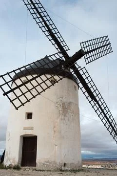 Ancient windmill with Consuegra town in the background. Toledo, Spain Foto stock