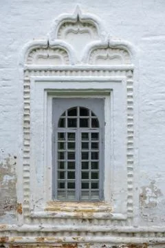 An ancient window in a brick white wall Stock Photos