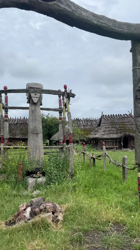 Ancient wooden structures and a ritual site in a field have great historical Stock Footage 279184474