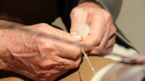 Ancient works. wool processing. hands of craftsman Stock Footage 126091511