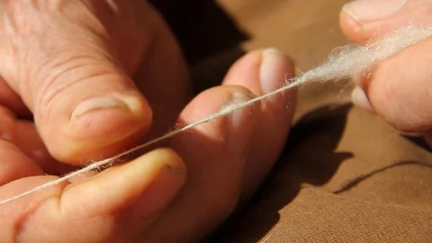 Ancient works. wool processing. hands of craftsman Stock Footage 126091531