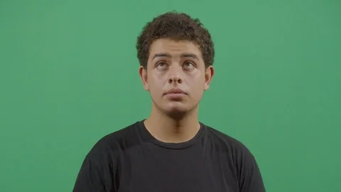 Up and down eyes movement of a young boy like reading very fast or chasing an Stock Footage 115338133
