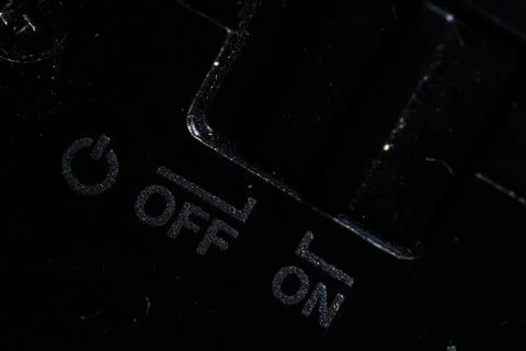 The on and off icon button is close on the camera device. Old and dirty Stock Photos