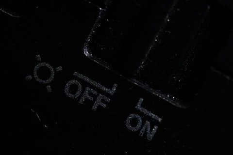 The on and off icon button is close on the camera device. Old and dirty. Macr Stock Photos